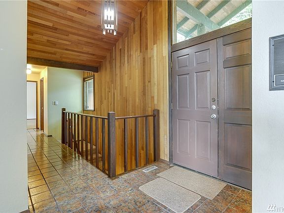 Grand entrance, open staircase to huge lower living area.