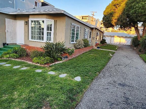Private garage (far right) with door opener and lots of storage, second parking spot directly in front of garage.