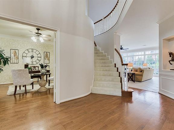 And the interior of this showplace is equally as charming and timeless as the extraordinary exterior! An oversized Study or Office to your left greets you as enter the Two Story Foyer. Rich Oak Gleaming Floors welcome you and a dramatic curved Stairc