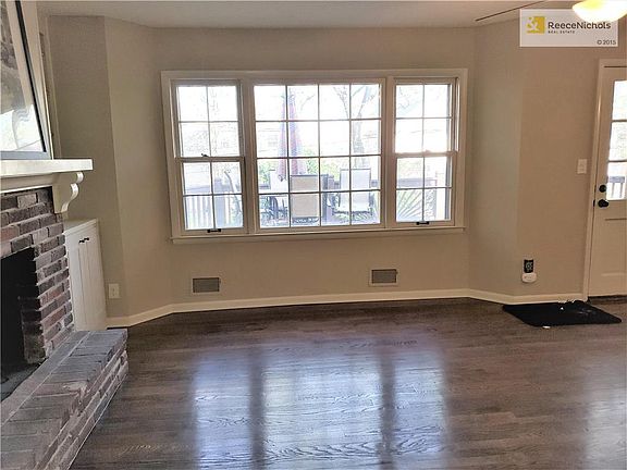 Light and bright Great Room with large hearth at fire place.