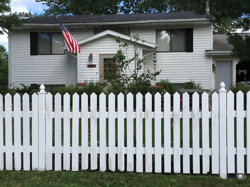 Front of house with fence