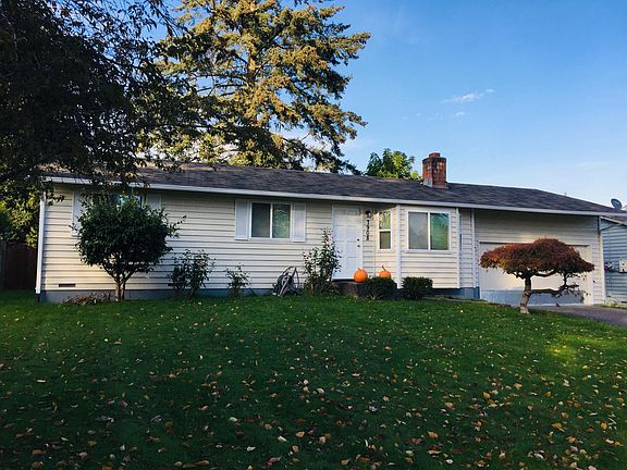 Front yard and 2-car attached garage with workbench