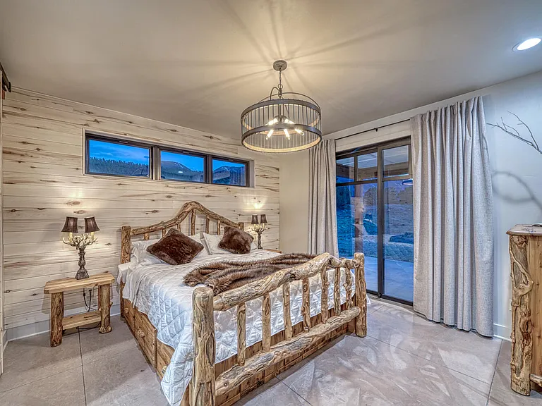 The primary room, The Lazy Bear Suite, is the host of a King Sized locally designed log bed. It is truly a work of art. Plenty of storage in the under-bed drawers as well as the dresser and night stands.