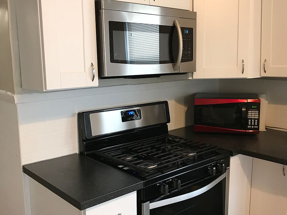 Modern kitchen with cooking area adjacent to eat-in dining area