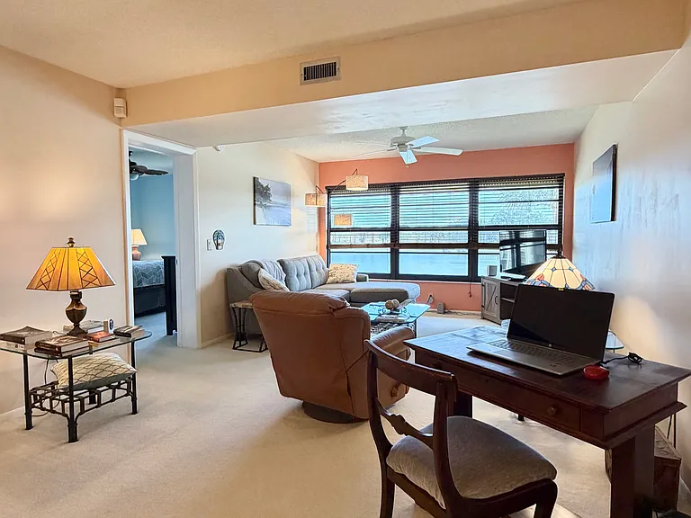 Cozy up and enjoy SPECTACULAR lake & golf course views from the living room!