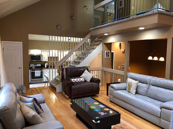 Living room with open dining and kitchen