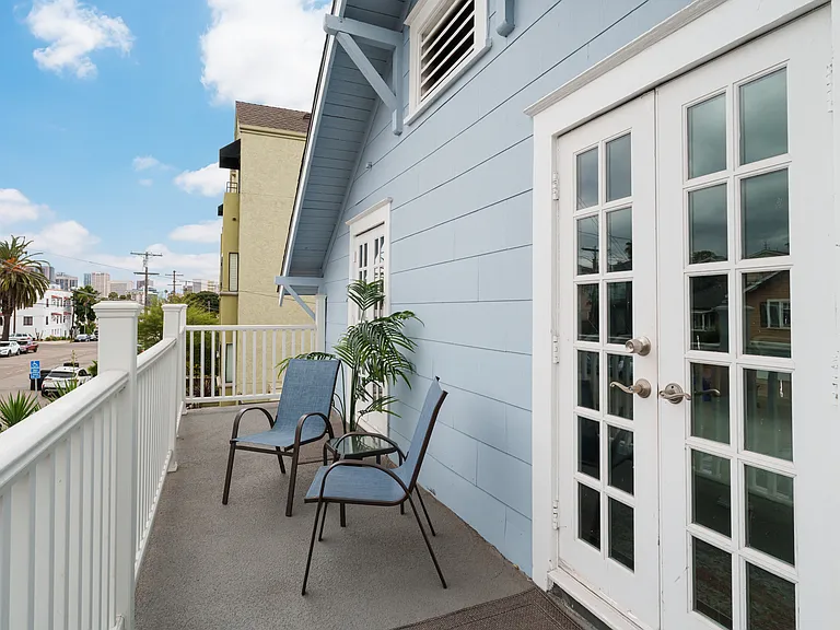 Private balcony connects both bedrooms.