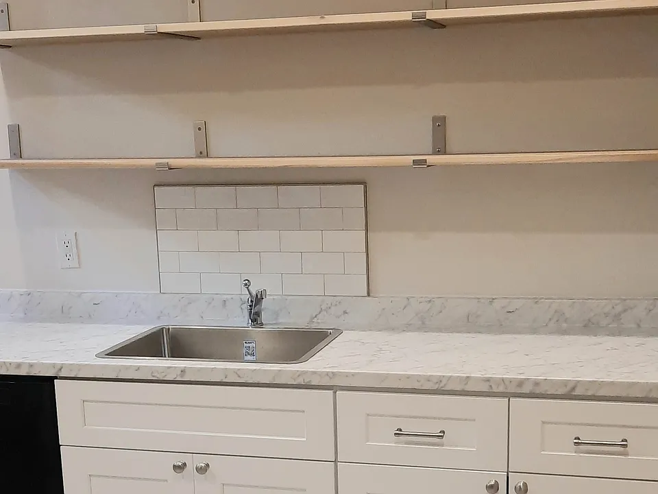 Opening shelving over sink w/ Italian tile backsplash