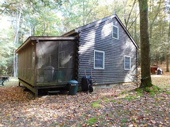 Screened porch overlooks stream
