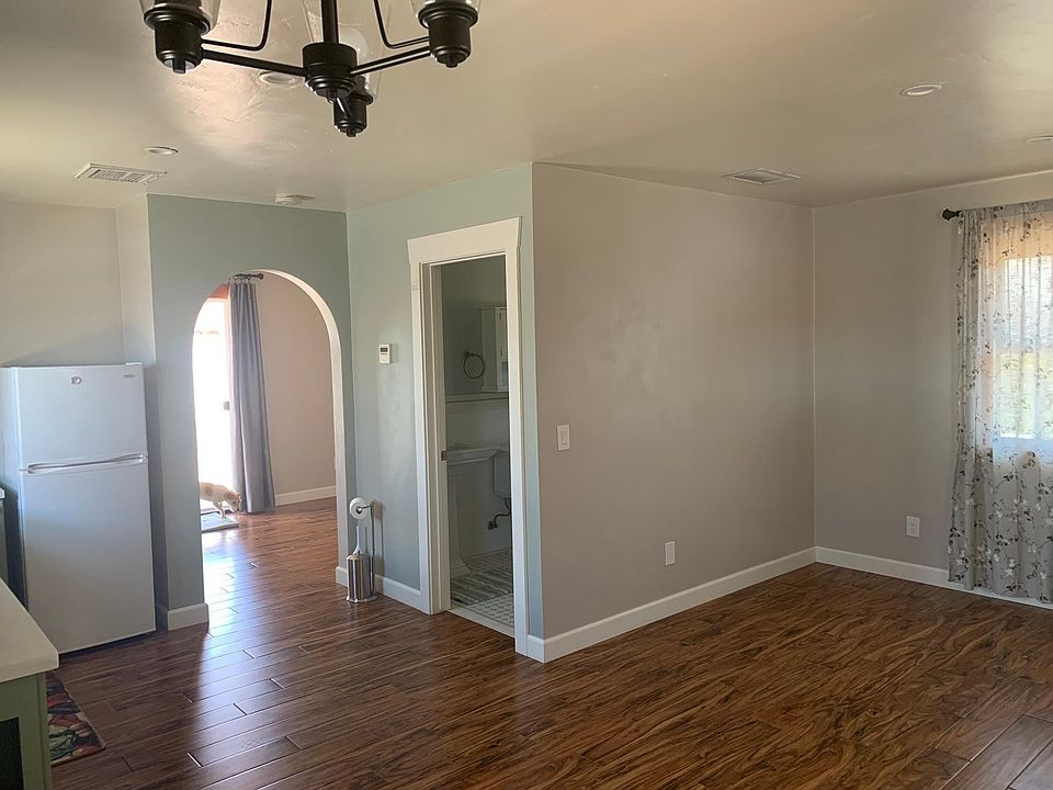 Living room and doorways to bathroom and bedroom