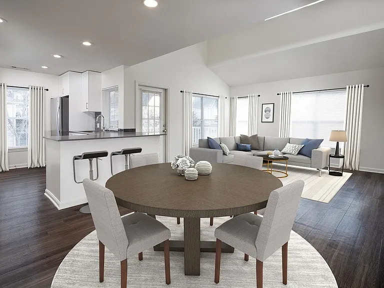 Kitchen, living, and dining areas with hard-surface flooring