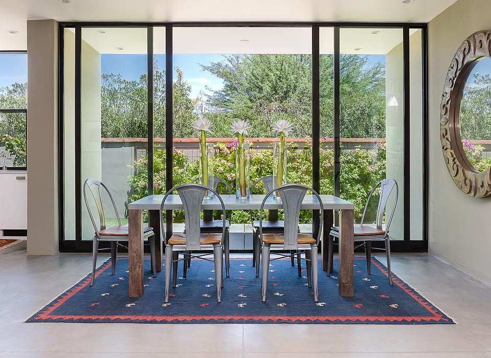 Dining area opens to patio. Note the polished concrete floors.