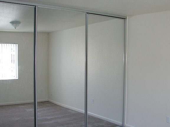 10 Foot long bedroom closet with mirror doors