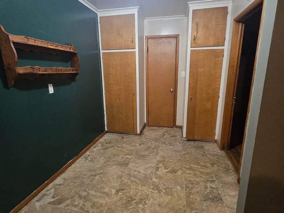 Dining or office area with great storage cabinets.