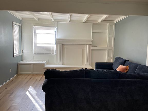 Living room with covered fireplace