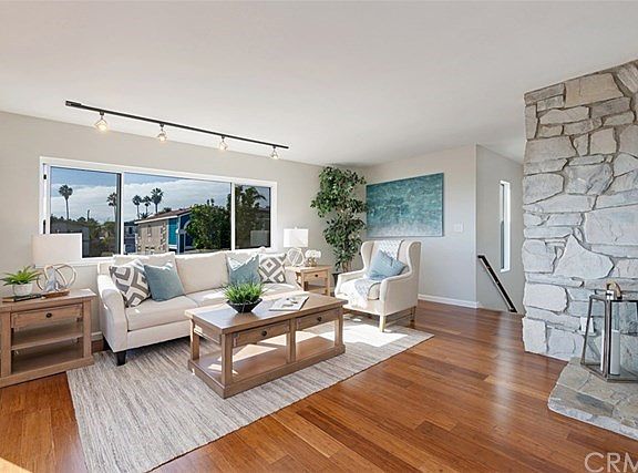 Sun drenched living room with gorgeous brand new wood floors