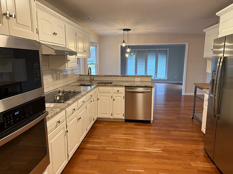 Kitchen with newer appliances.