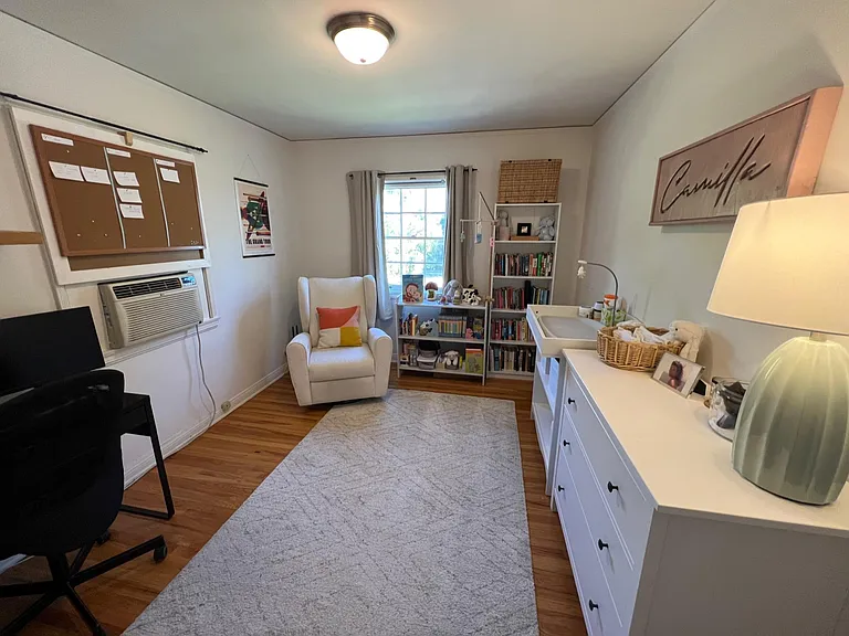 Second bedroom (one window is covered with a bulletin board)