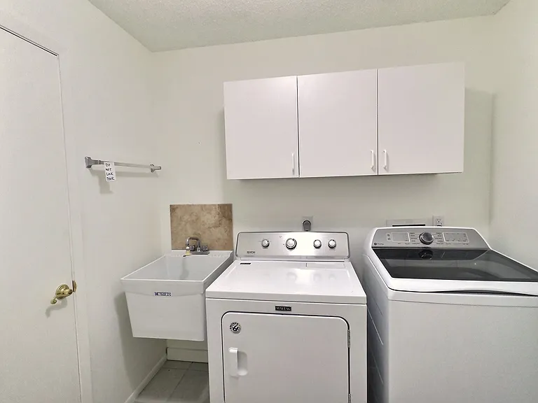 Laundry room with sink