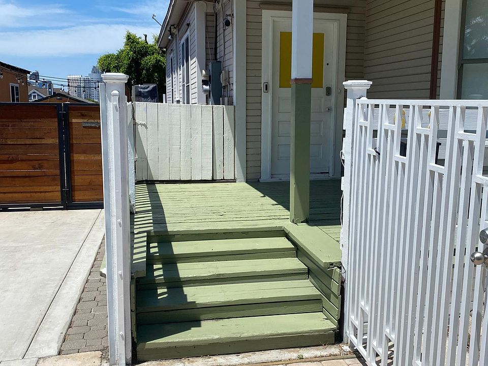 Enter through this steel mounted front security gate. The gate design was modeled to match the design of the wood framed front fence. NOTE: The second wood frame WHITE gate in the background leads to YOUR unit #2.