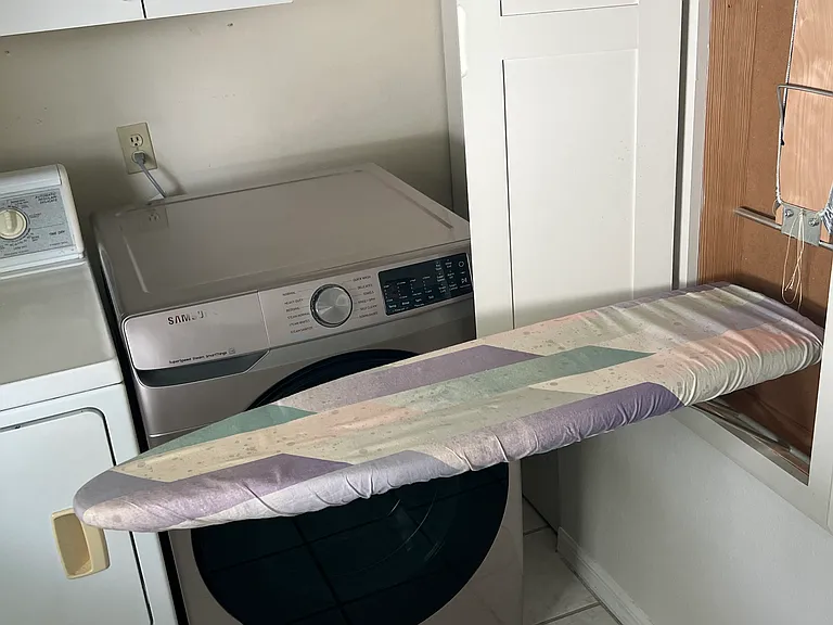 Fold down ironing board in laundry room