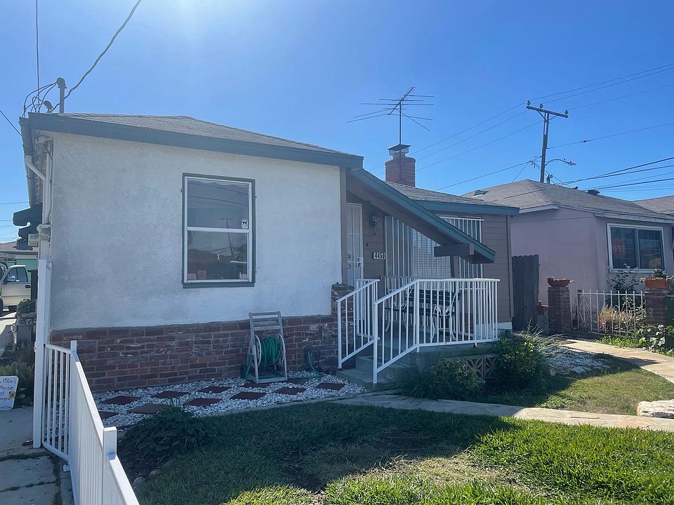 Front of house with gated front yard