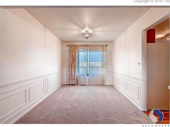 Bright dining room with backyard views