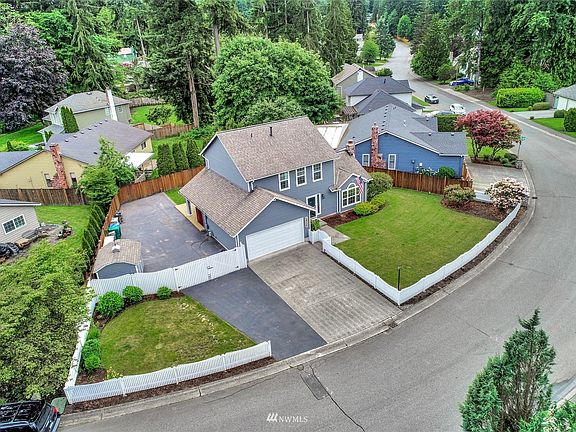 What an amazing lot! Plenty of parking, and definitely plenty of room for an RV with the double gated fence 