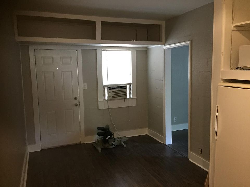 From kitchen to living area. Window unit has been replaced with split unit for AC & heat.