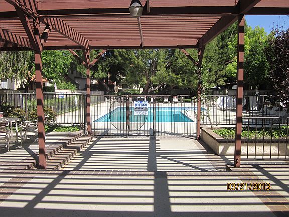 to the left of patio