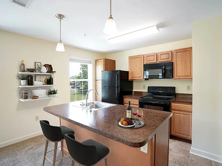 Kitchen with built in microwave and breakfast island