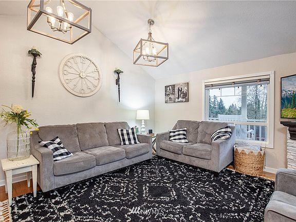 Living room has vaulted ceilings