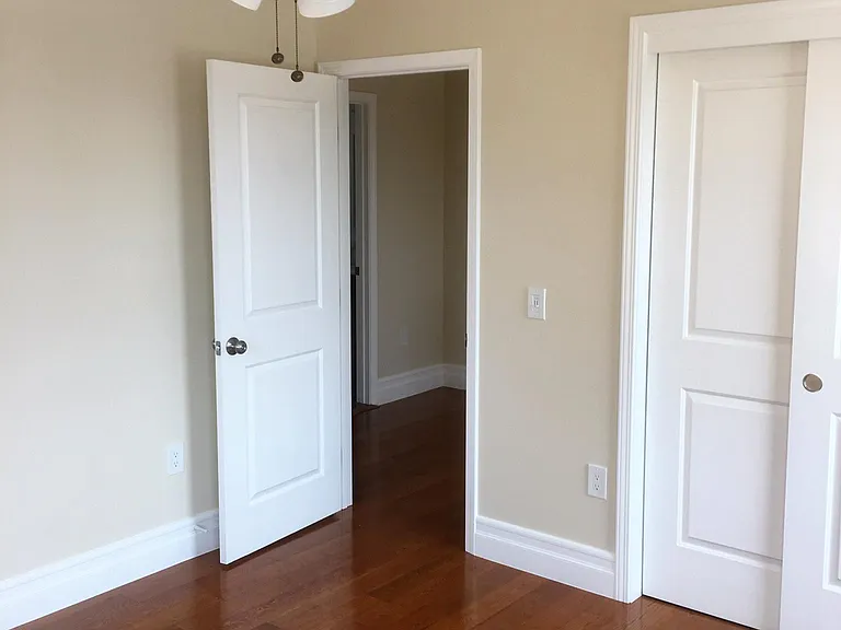 BEDROOMS 2 & 3 ARE BOTH THE SAME SIZE AND SHAPE. CLOSET VIEW WITH ENTRANCE FROM UPSTAIRS HALL, AND INCLUDES CEILING FAN AND LIGHT.