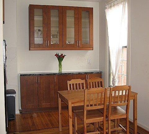 Open living/dining space with plenty of cabinets