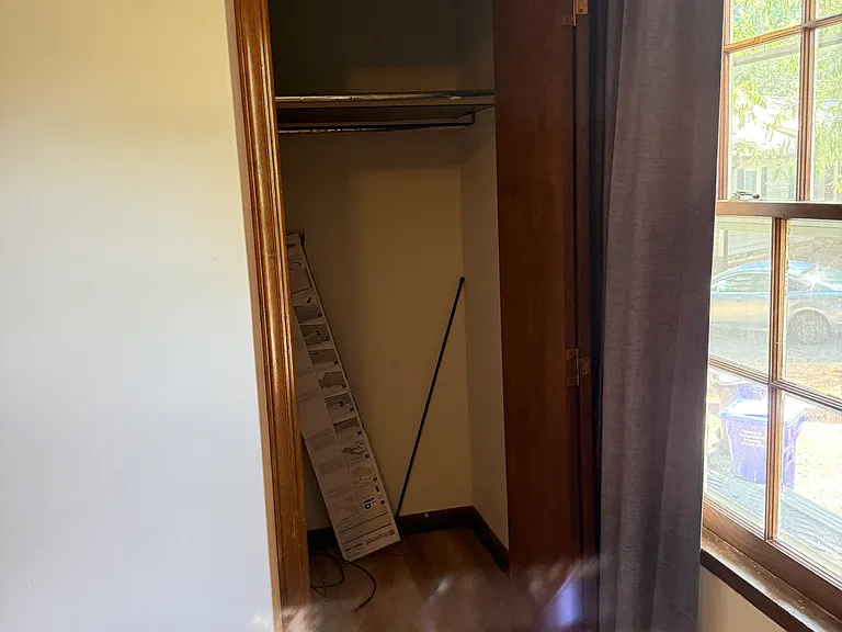 Closet space in the bedroom facing the front of the unit.