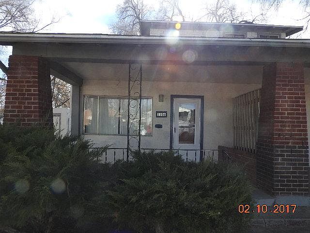 Front entry with patio, porch, and wrought iron railing