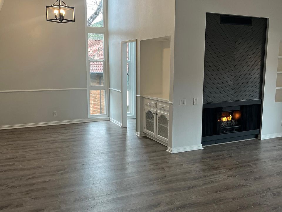 Living/Dining area with vaulted ceilings, bar area, new windows with a lot of natural light