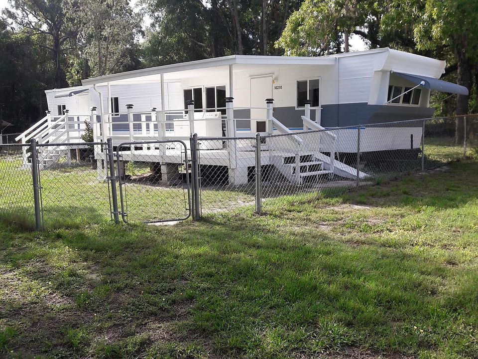 520 Sq Ft mobile home with fenced in yard on 80' X 80' lot.