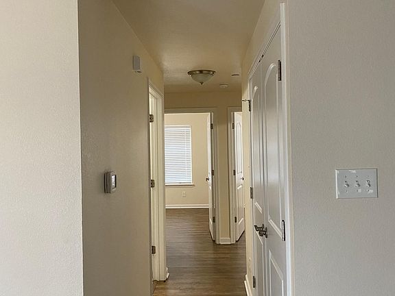 Hallway (double doors house washer and dryer)