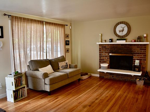 Living room with wood burning fireplace