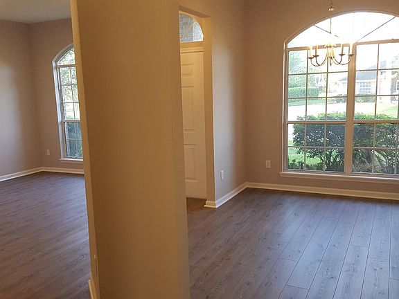 Living room to left and dining room on right