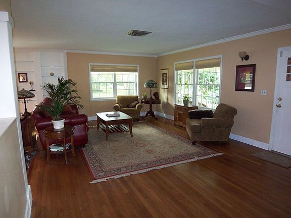 Open living room with the dining room and kitchen to left