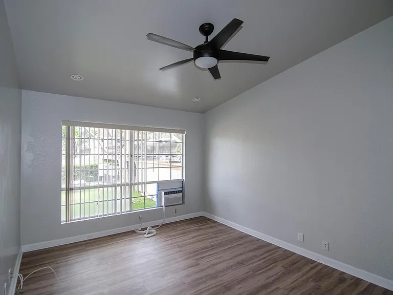 Large master bedroom comes with recess lighting, ceiling fan and A/C