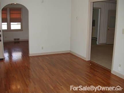 Living room, archway to dining room