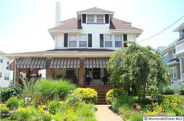 Rocking Chair Porch on this Classic Seashore Colonial