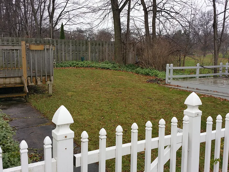side yard and deck from 1st floor bedroom and additional deck.