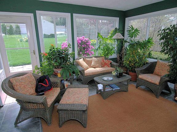 All-season sunroom looking onto back yard