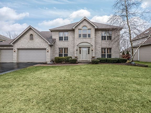 Full brick front with oversized driveway with great curb appeal.  Well maintained landscaping located on interior fenced lot with mature landscaping.