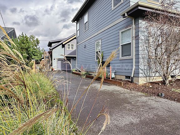 Shared Driveway with Unit B. Unit B is located above the garage and is NOT included in this listing (occupied tenants). Garage Space for Unit A is to the left if facing garage or straight ahead.