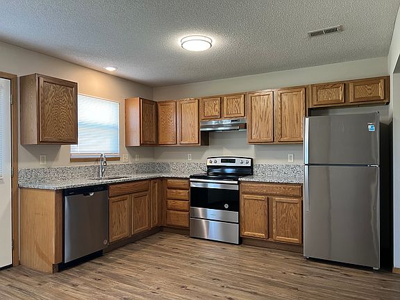 Kitchen with granite and stainless steel appliances